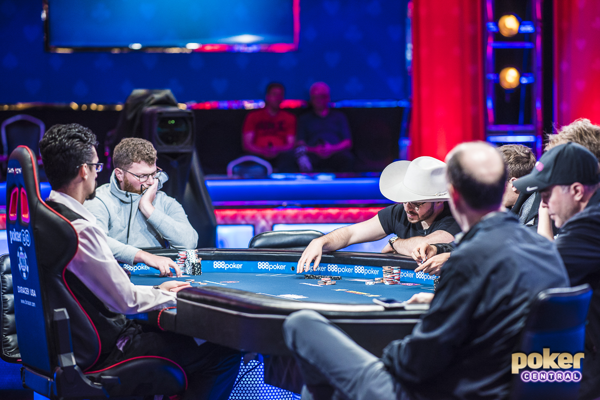 Surrounded by fellow sharks at the feature table, Nick Petrangelo faces off against Dan Smith and Erik Seidel.