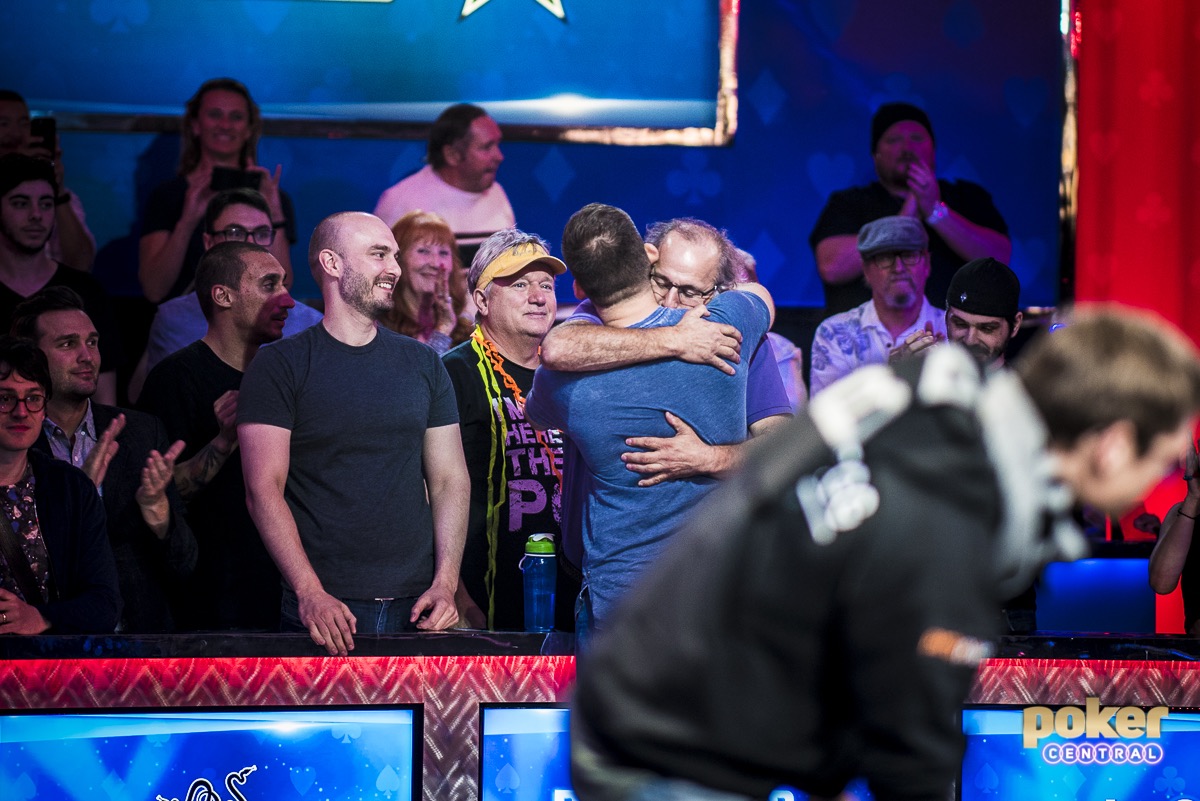 Justin Bonomo hugs his father after winning the Big One for One Drop.