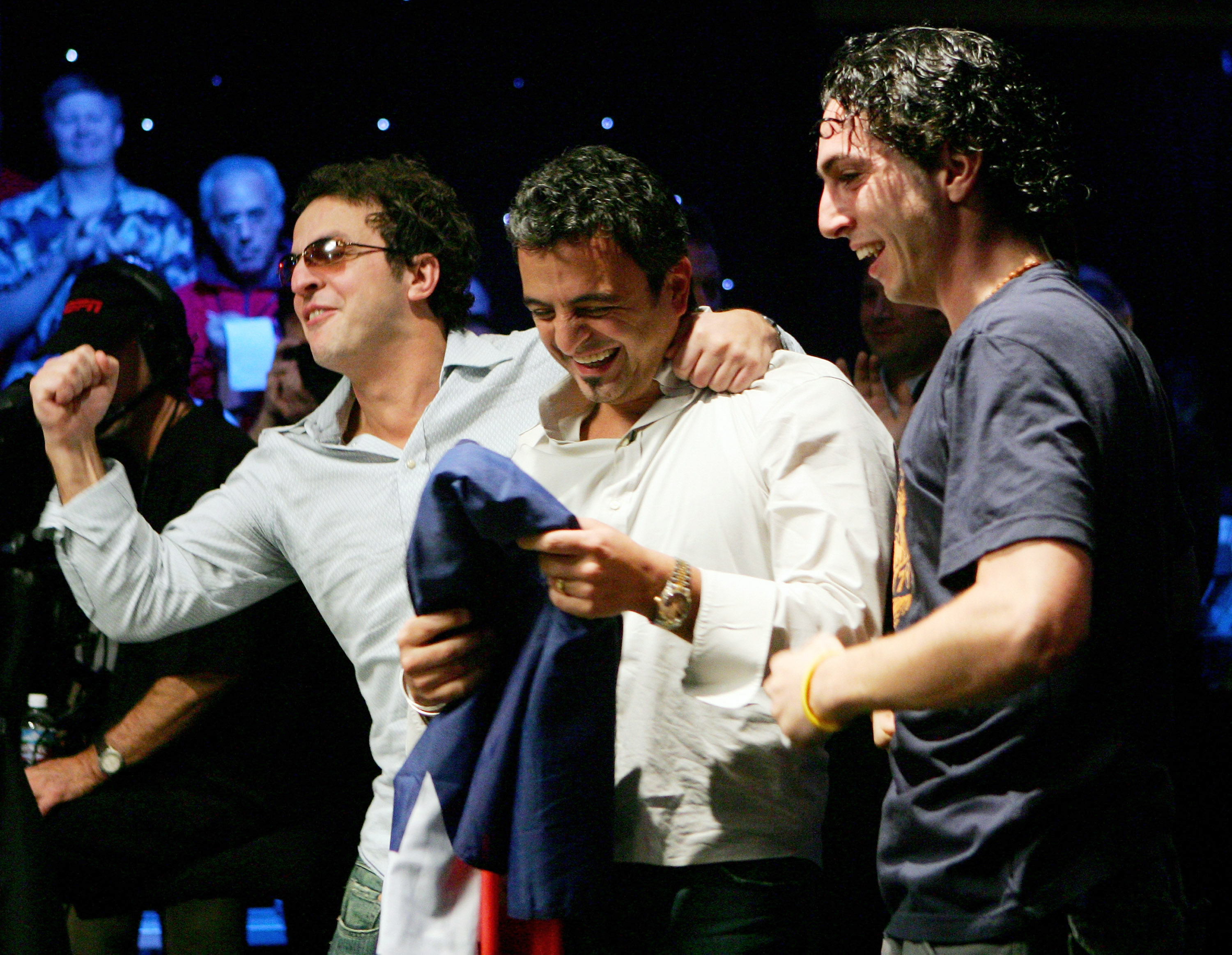 Joe Hachem celebrates his 2005 WSOP Main Event win with his brother Tony and cousin Billy Sukkar. (Image: Getty)