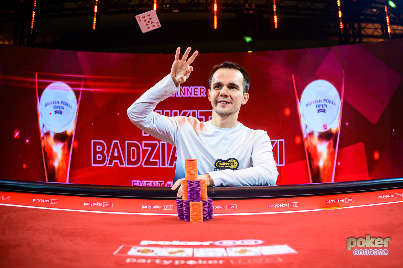 Mikita Badziakouski throws his winning cards in the air after winning Event #9 of the British Poker Open.