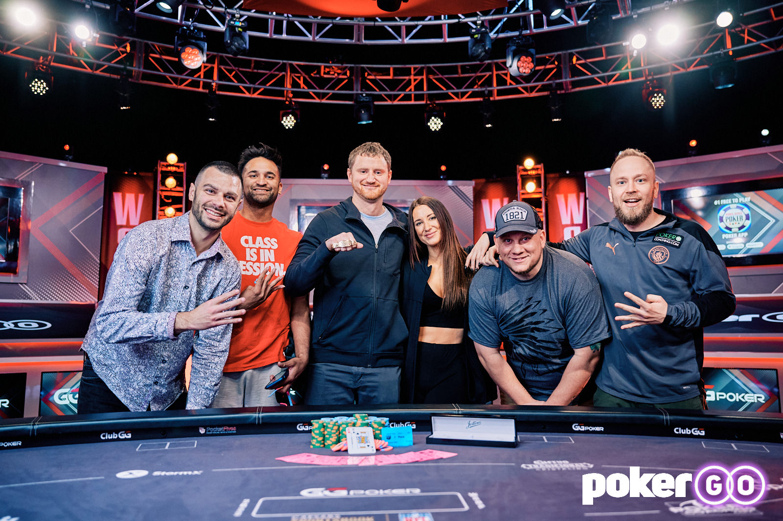 David Peters celebrates winning his fourth WSOP bracelet with friends.