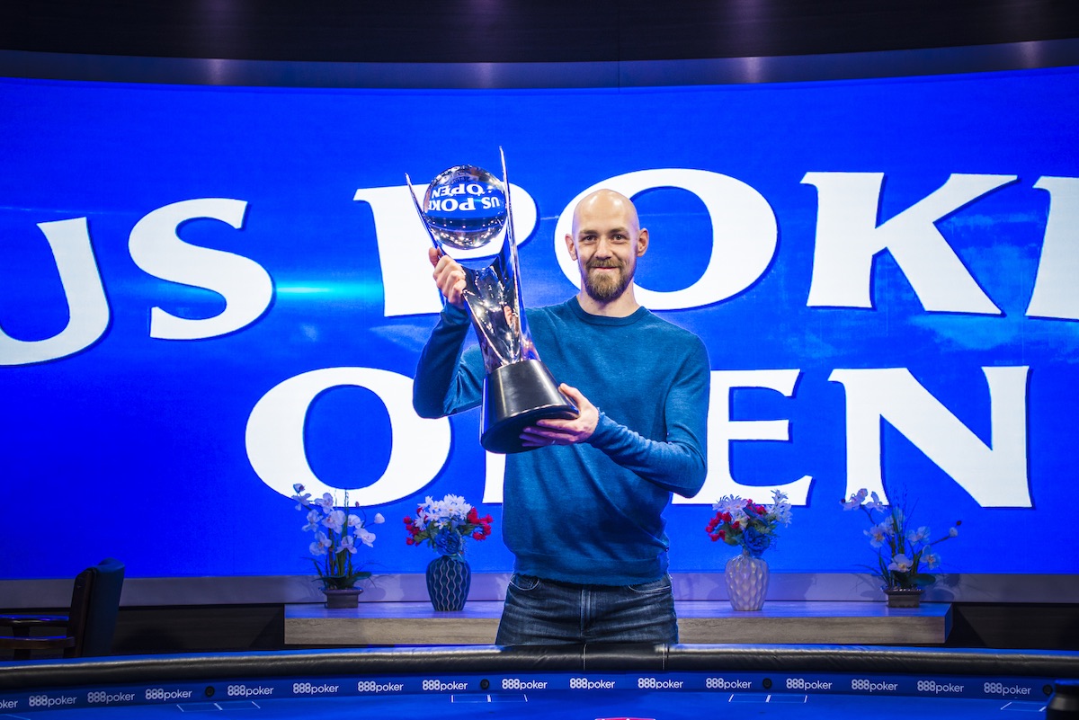 Stephen Chidwick proudly hoists the biggest trophy of his live poker career at the 2018 U.S. Poker Open.